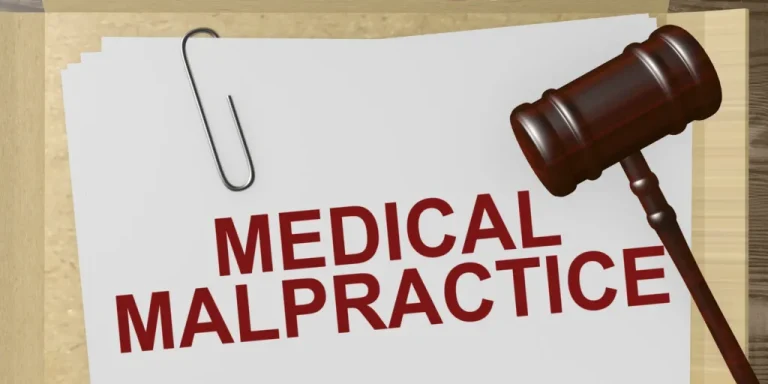 Medical malpractice insurance folder and gavel representing legal coverage for IMEs