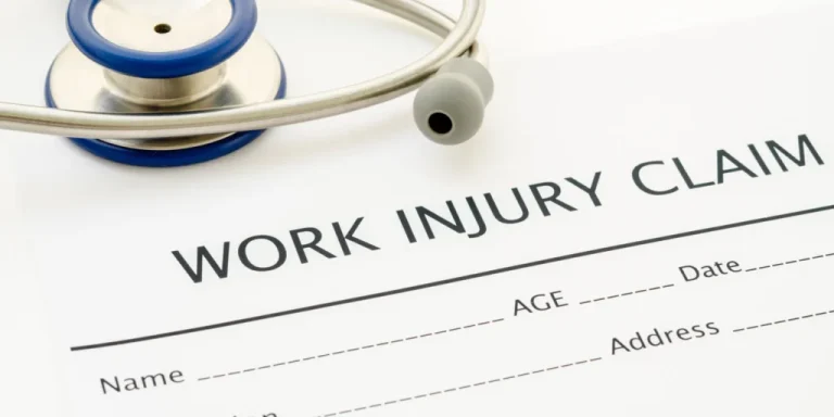 section of a form with "Work Injury Claim" stamped on top with stethescope nearby