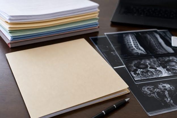 Organized medical records and diagnostic images prepared for IME addendum review